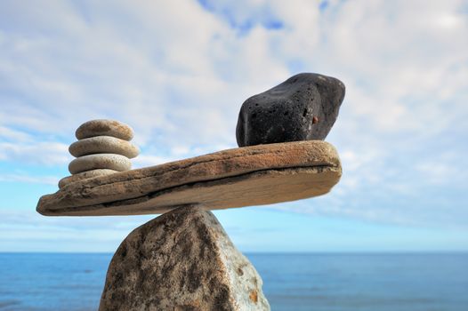 Well-balanced of pebbles on the top of stone