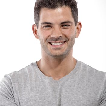 Portrait of a handsome latin man smiling, isolated over a white background