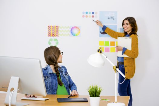 Women working at desk In a creative office, team work 