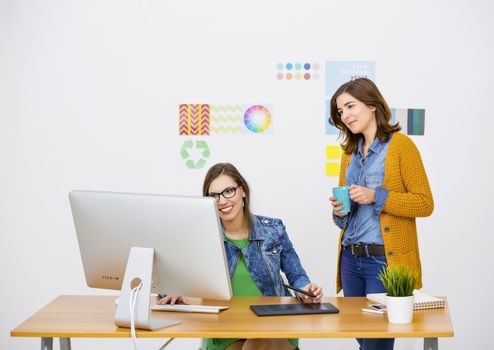 Women working at desk In a creative office, team work 