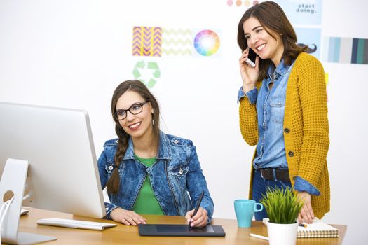 Women working at desk In a creative office, team work 