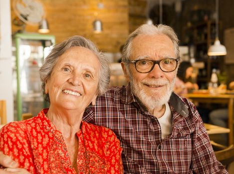 Old couple at the restaurant and  having a good time 