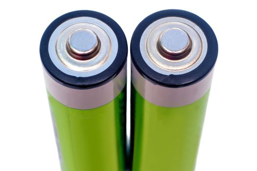 Closeup on a white background depicts two rechargeable electric batteries in an upright position.