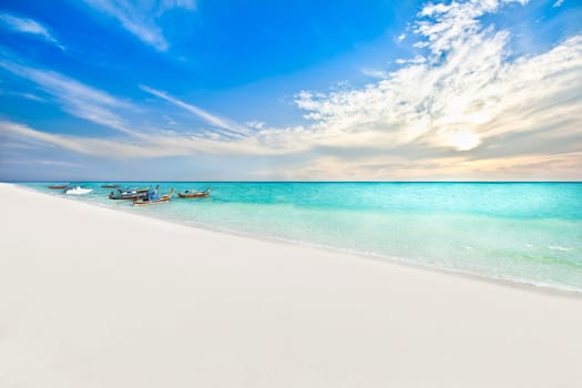 Boats on the beach at sunrise time, Lipe island Thailand