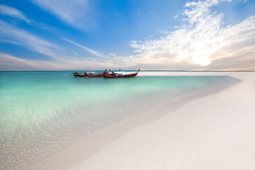 Fishing boats on the beach at sunrise time