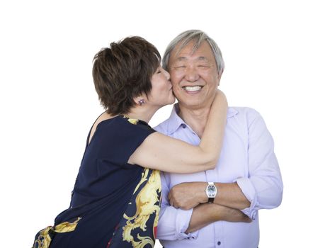 Attractive Affectionate Senior Chinese Couple Isolated on a White Background.