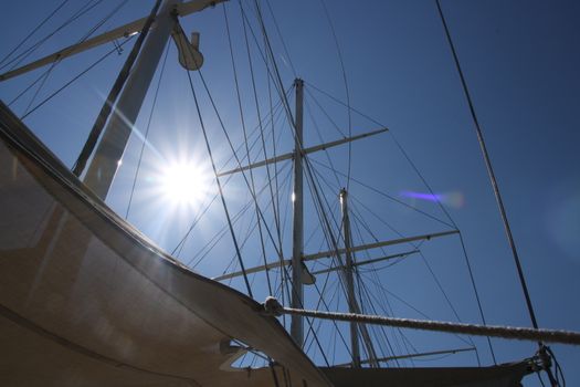 Looking up at sails and mast of boat yachting 10k