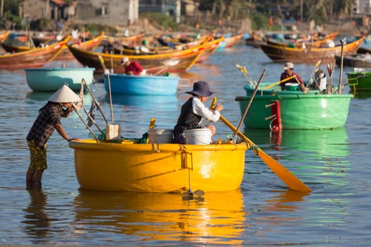 MUI NE, VIETNAM - FEBRUARY 08, 2014: Fishermen at work near Mui Ne - an upcoming touristic area in Southern Vietnam