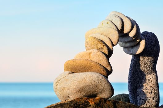 Stones laid out in the form of arch on the coast