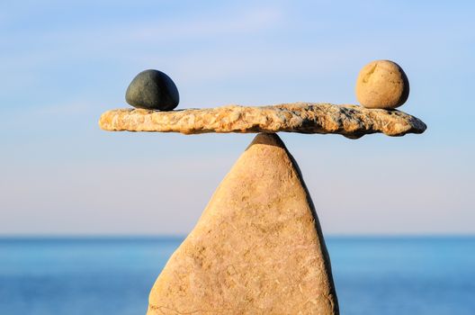 Well-balanced of pebbles on the top of stone