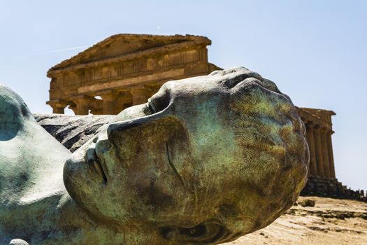 Concordia Temple behind the bronze sculpture of Icarus, person of greek mythology - Valley of the temples 