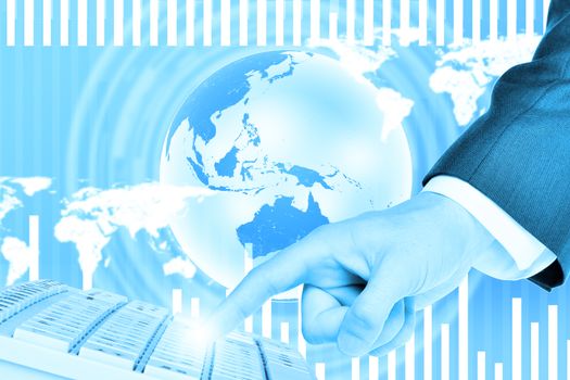 Businessmans right hand touching keyboard on abstract blue background with world map and Earth. Elements of this image furnished by NASA