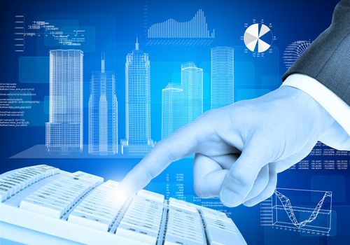 Businessmans right hand touching keyboard on abstract blue background with graphs