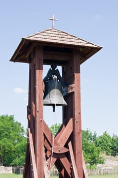 This made of wood bell tower memorial.