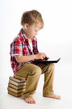Little boy with a Tablet PC. studio