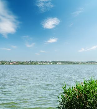 river and blue sky with clouds