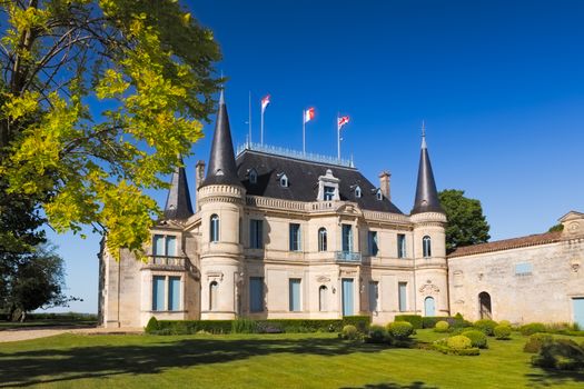 BORDEAUX, FRANCE -  MAY 2014: Chateau Palmer - one of the most famous winemakers in France at a cloudless day