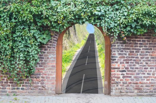 Photomontage, a gate in a wall into a park. Behind the open door you see a road to a small chapel.