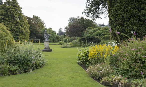 big english garden with borders and flowers