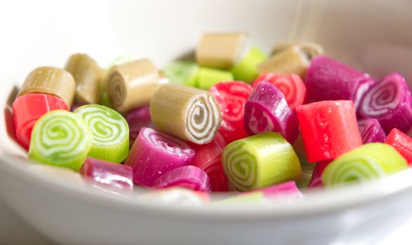 Colorful candies on white background