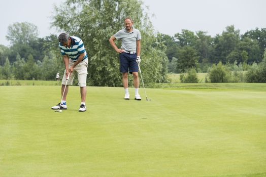 DELDEN,HOLLAND- JULI 5:Unidentified golfers participate in open golf tournement on Juli 5 2015 in Delden Holland, this game is held once a year