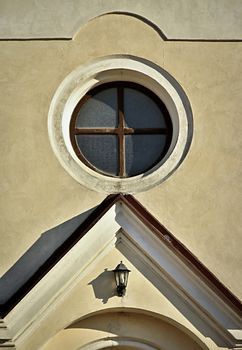 Detail of an old historic building with a circular window