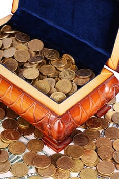 Coins and banknotes in the box close-up