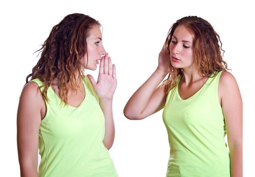 Two identical girls share secrets with each other sisters