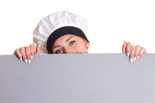 Chef Sign. Woman cook / baker looking over paper sign billboard. Surprised and funny expression / Caucasian woman isolated on white background.