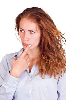 Beautiful pensive woman in front of a white background.