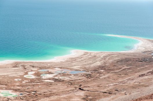 Natural environmental disaster on Dead Sea shores. Water level decreases and surface rapidly shrinking due to human activity.