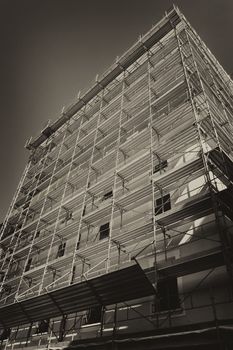 Building with a black and white scaffold