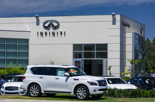 LOS ANGELES, CA/USA - JULY 11, 2015: Infiniti automobile dealership sign and logo. Infiniti is the luxury vehicle division of Japanese automaker Nissan.