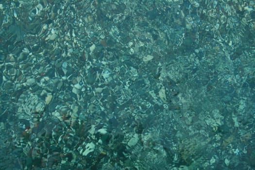 the small round Stones in the crystal clear water