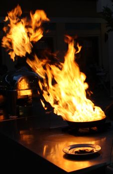 Fire gas burn is cooking on iron pan,stir fire very hot