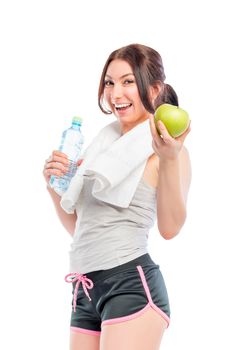 young woman with a beautiful smile holding an apple