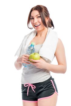 young woman with a beautiful smile holding an apple