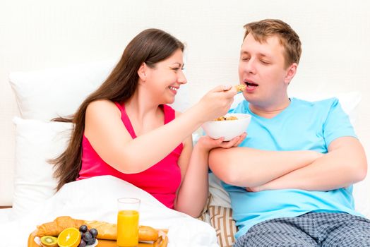 girl gives to her husband taste muesli