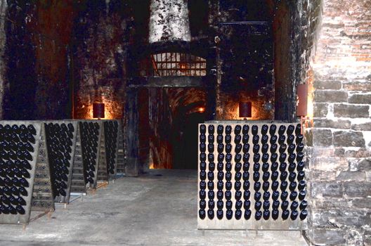 Wine bottle in the old cellar of a winery