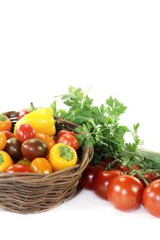 Vegetable basket with mixed vegetables on a light background