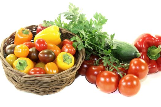 Vegetable basket with mixed colorful vegetables on a light background