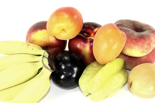 Various colorful fruits on a light background