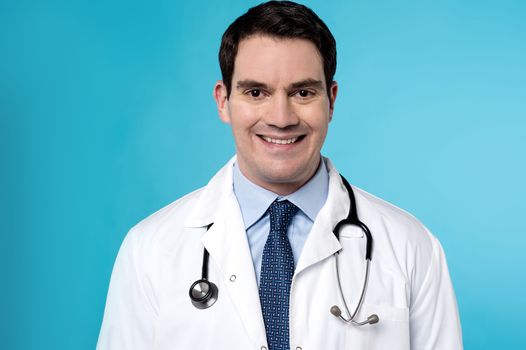 Male physician with stethoscope around his neck