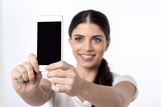 Beautiful woman taking a picture of herself