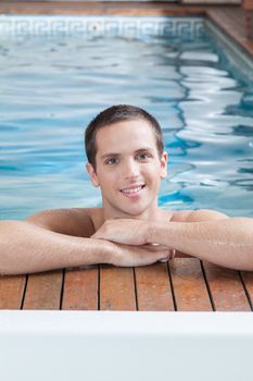Happy man inside the pool
