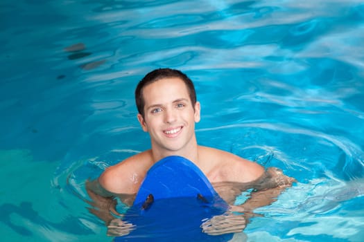 Man inside the pool with floater