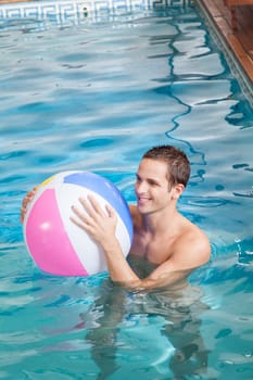 Man playing with inflatable ball