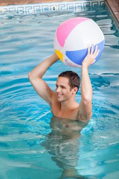 Man holding a inflatable ball