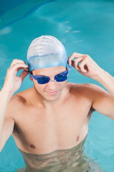 Guy putting on goggles