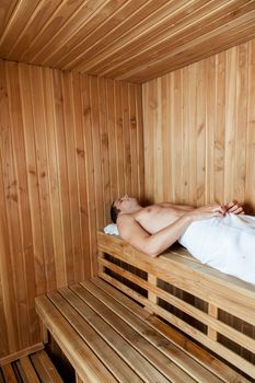 Man laid inside the sauna